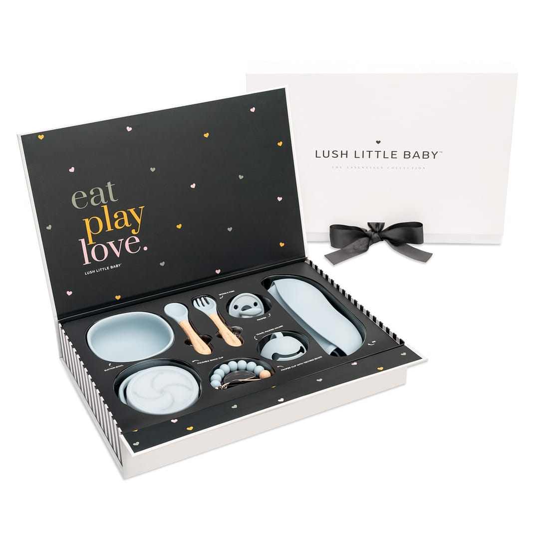 Z61_5670-Edit Copper teapots, nuts and candles surrounding baklava in yellow boxes on a oak wood table